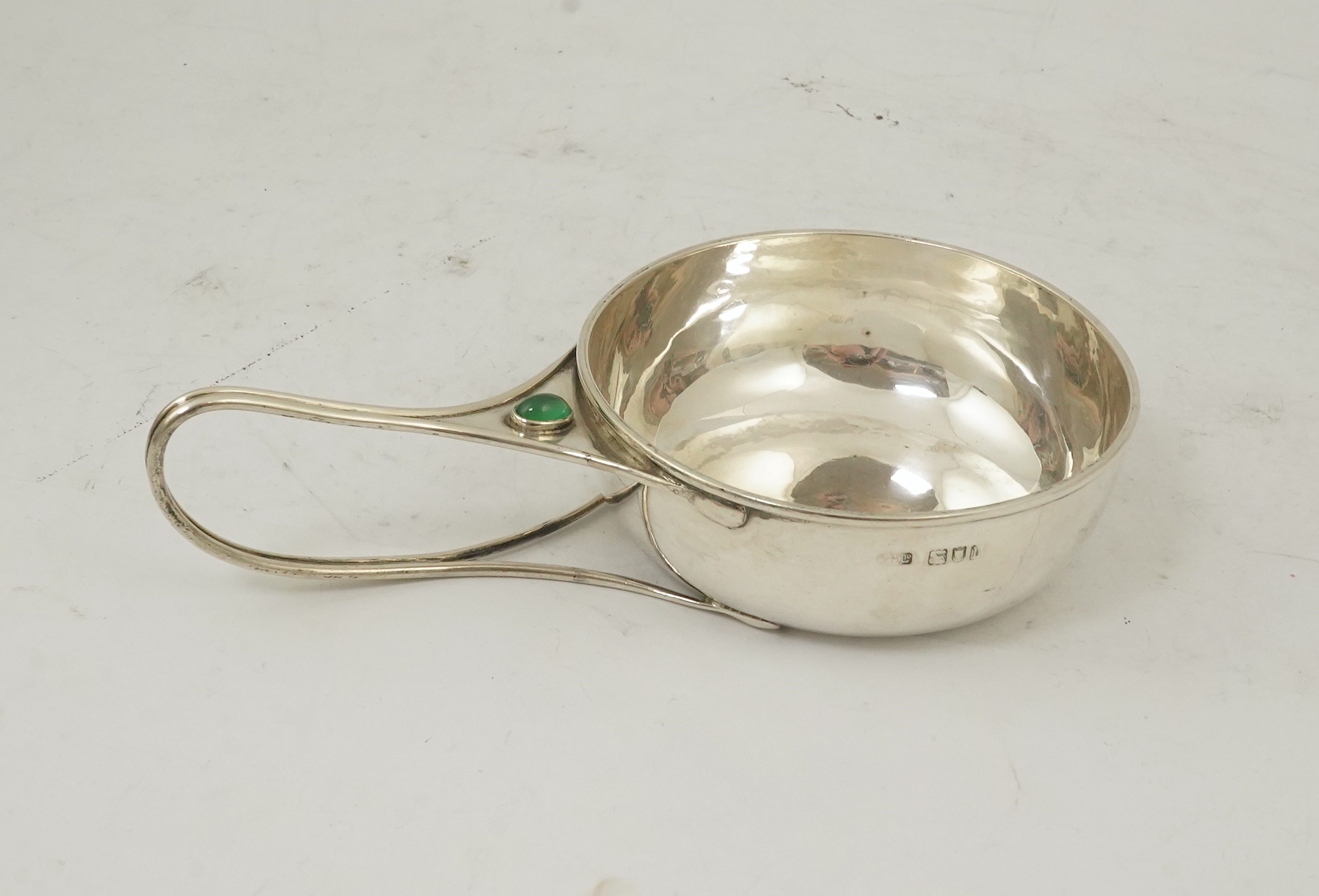 An Edwardian Arts & Crafts Charles Robert Ashbee for the Guild of Handicrafts Ltd silver and single stone cabochon chrysoprase set porringer